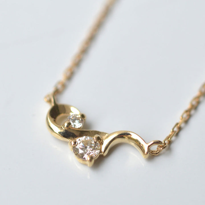 幸せを運ぶもの・ダイヤモンドネックレス・風【K10YG】21W